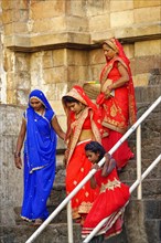 Worshipers going down stairs of a temple