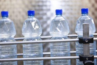 PET bottles on an assembly line in a mineral water factory