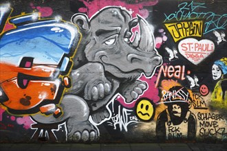 Colourful graffiti on a construction site barrier