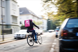 Delivery of food by a courier driver on a bicycle