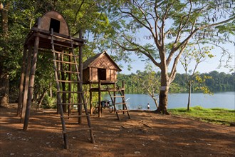Stake houses of the indigenous Kroeung Tola people at the crater lake Yeak Laom