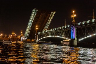 Opened Trinity Bridge over the river Neva at night