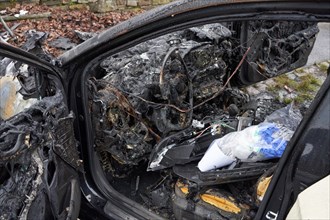 Burnt out car in a traffic accident