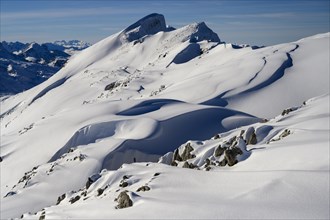 Summit of the Toreck with snow cornices and blue sky