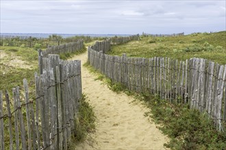 Fenced path leading to Saint Pierre beach