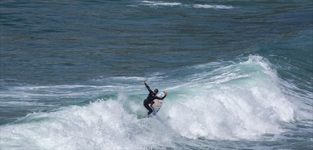 Surfers in the bay of Minou