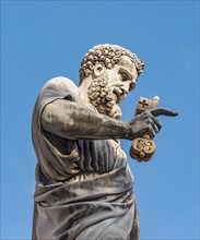 Statue of St. Peter holding the key at Piazza San Pietro