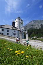 Cyclists in front of the pilgrimage church Mariastein