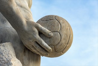 Athlete statue with a ball at Stadio dei Marmi