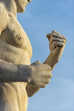 Close-up of fists of fighter statue at Stadio dei Marmi