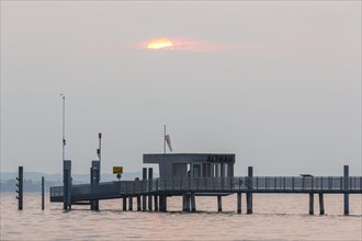 Longest jetty at Lake Constance in the morning light in Altnau