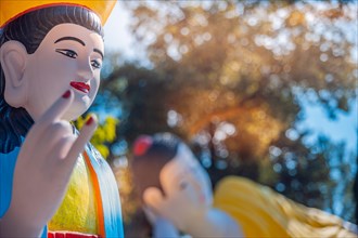 Holy figures with lying Buddha