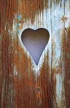 Wooden shutter with sawn out heart