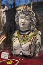 Shop window with decorated bust