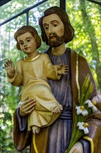 Wooden statue of St. Joseph of Nazareth with the Boy Jesus