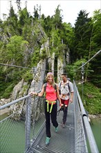 Hikers on the suspension bridge of the Grossache