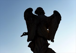 Silhouette of angel statue