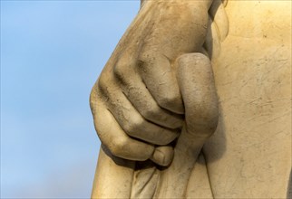 Close-up of hand of athlete statue at Stadio dei Marmi