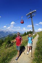 Hikers on the summit panorama trail of the Hohe Salve