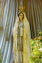 Statue of the Virgin Mary with golden crown of the Virgin Mary