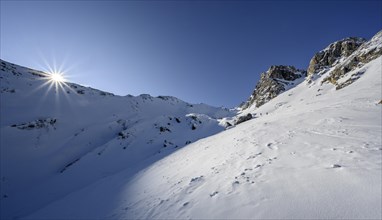 Sun shines over mountain ridges