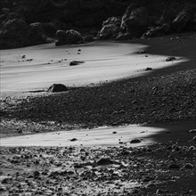 Water washes around stones