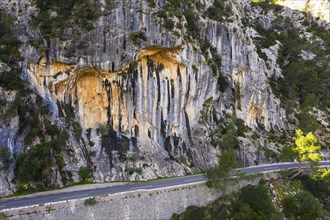 Rock formation on limestone and mountain road at the Coll de Sa Bataia in the Serra de Tramuntana