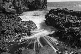 Water washes around stones