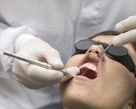 Dental treatment with laser