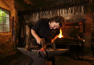 Blacksmith at the anvil