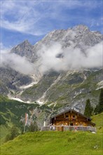 Alpine hut with view to the Hochkoenig