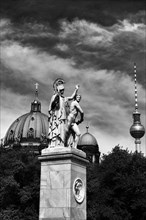 Berliner Dom (Berlin Cathedral) and Fernsehturm (TV Tower) behind statue on the Schlossbruecke bridge to Museumsinsel (Museum Island)
