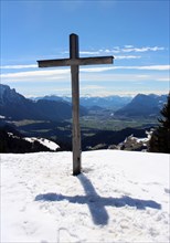 Summit cross on the Karspitze with view of the Inn Valley