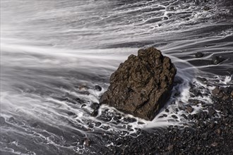 Water washes around stones