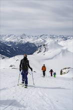 Ski tourers in the snow