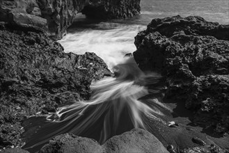 Water washes around stones
