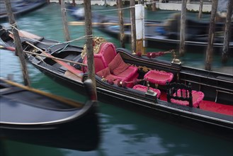 Gondola with red seat cushions