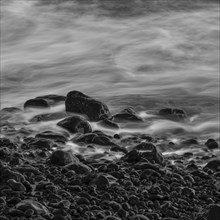 Water washes around stones