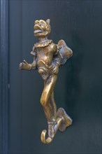 Antique bronze figure as door knocker
