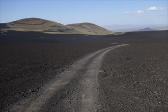 Track through volcanic lunar landscape