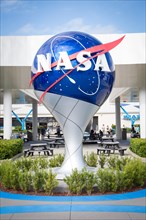 Nasa logo in front of Kennedy Space Center