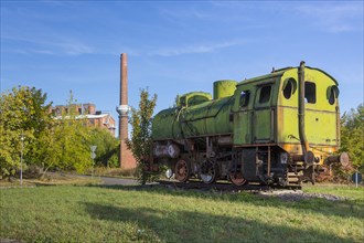 Old locomotive and factory buildings