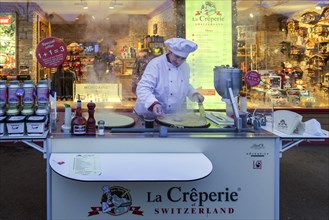 Woman preparing a crepe