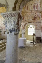 Column and frescoes from the 11th century in the church Saint Genest