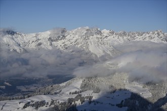 View from the summit of the Hohe Salve to the snowy Wilder Kaiser
