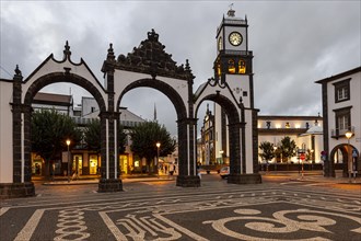 Portas da Cidade gates and the church of St. Sebastian in the evening