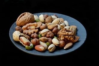 Various nuts on plates