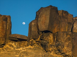Moonrise between stones