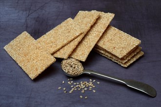 Sesame bar and sesame seeds in spoon