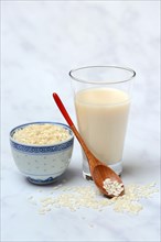 Rice milk in glass and rice grains